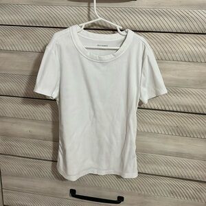 Girls white small old navy shirt the material is ribbed knit and logo is peeling